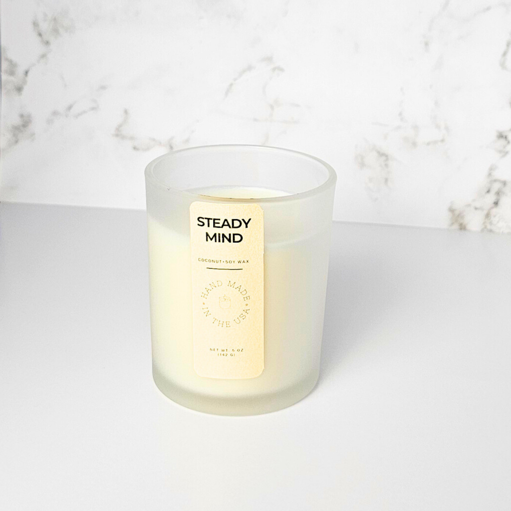 Wickless Candle with 'Steady Mind' label on a marble surface