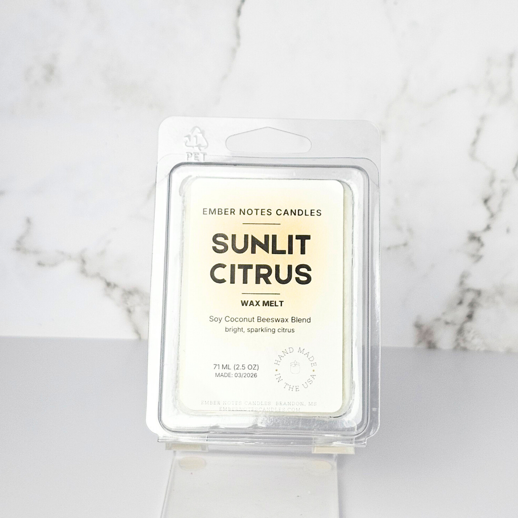 Sunlit Citrus wax melt packaging on a marble background