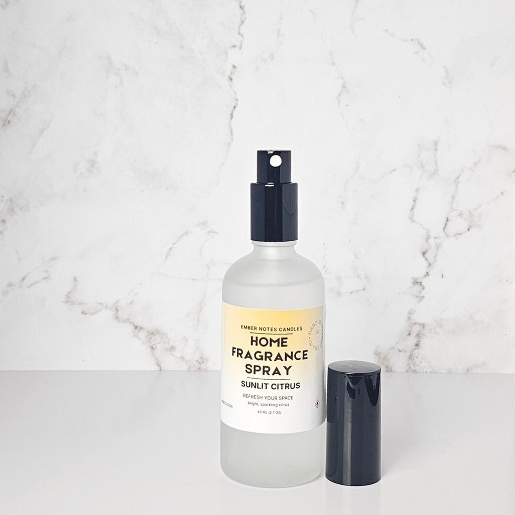 Home fragrance spray bottle with a label on a marble background