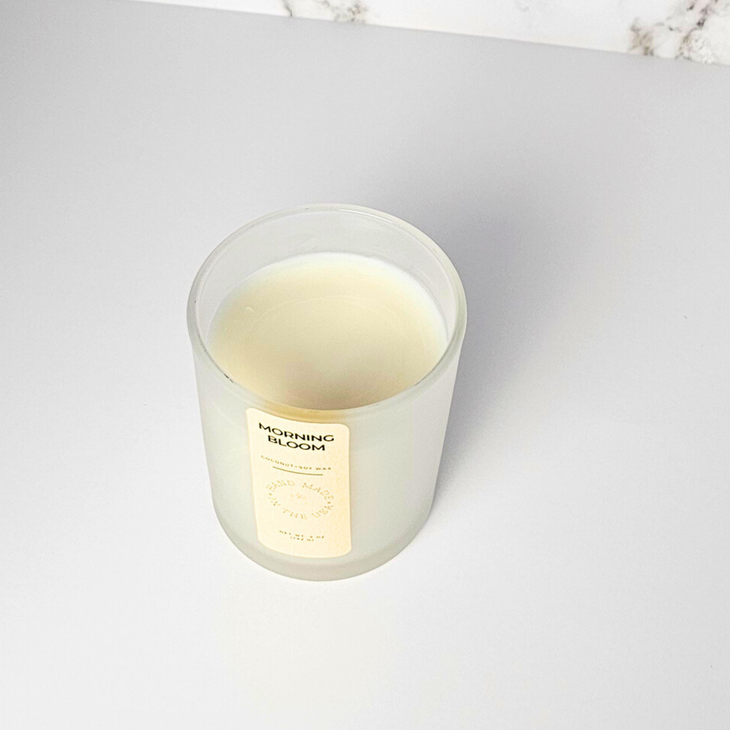 Wickless Candle labeled 'Morning Bloom' on a white surface