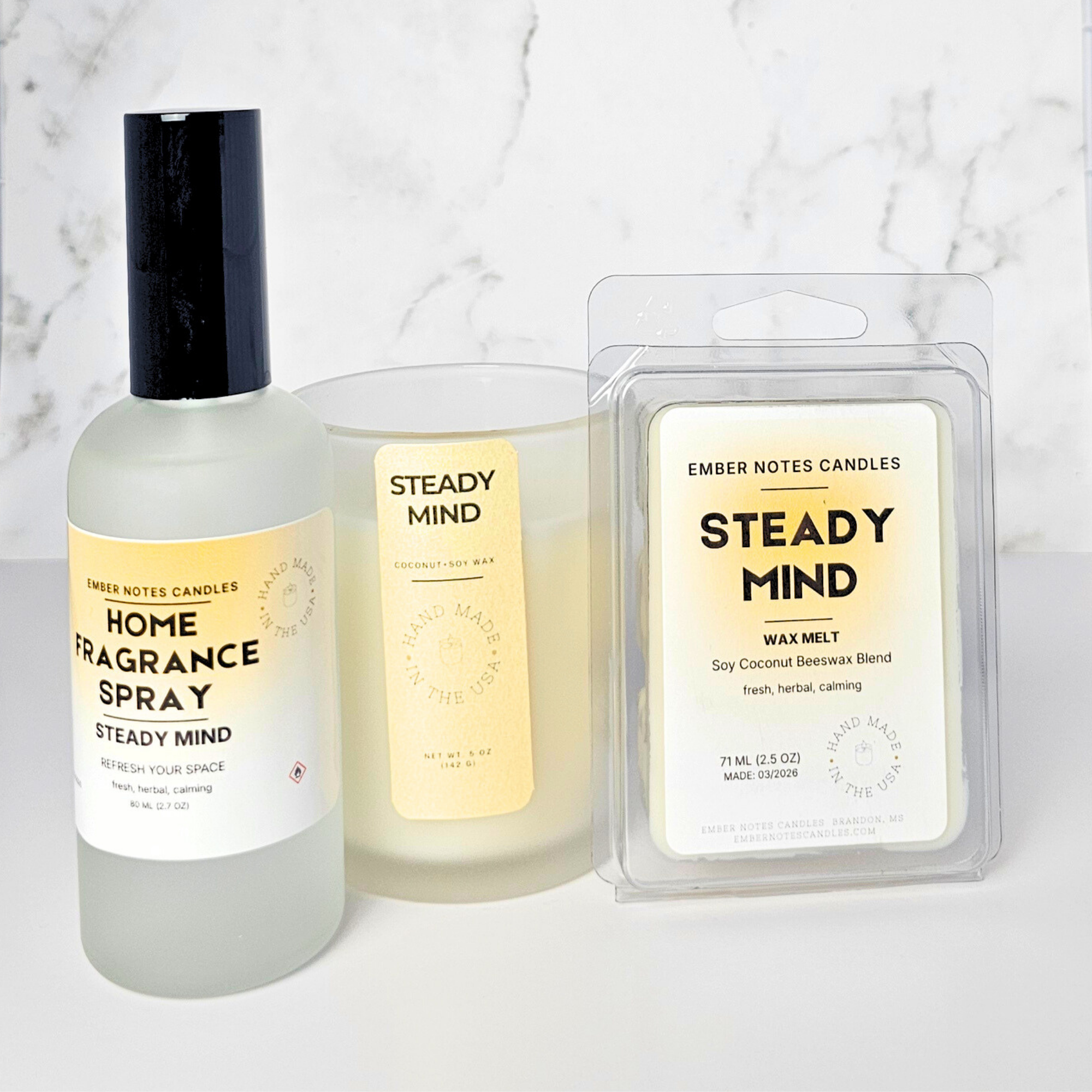 Home fragrance spray, candle, and wax melt set with 'Steady Mind' label on a marble background