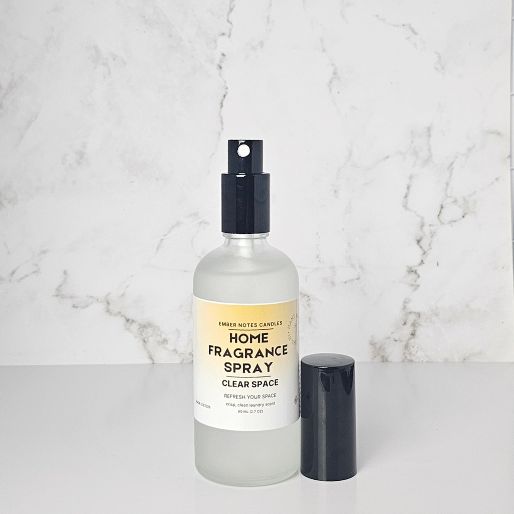 Home fragrance spray bottle on a marble surface