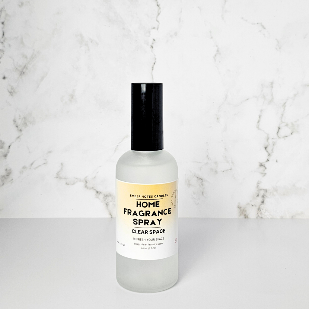 Home fragrance spray bottle on a marble surface