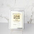 Ember Notes Candles wax melt packaging on a marble surface