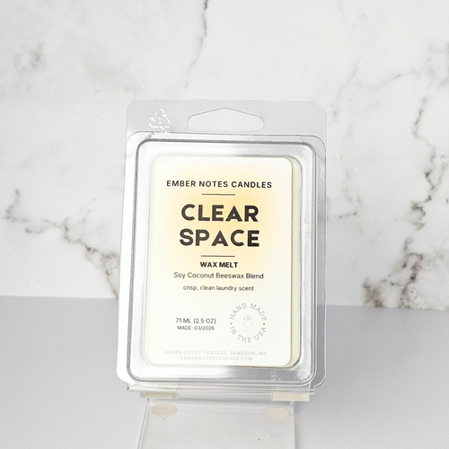 Ember Notes Candles wax melt packaging on a marble surface