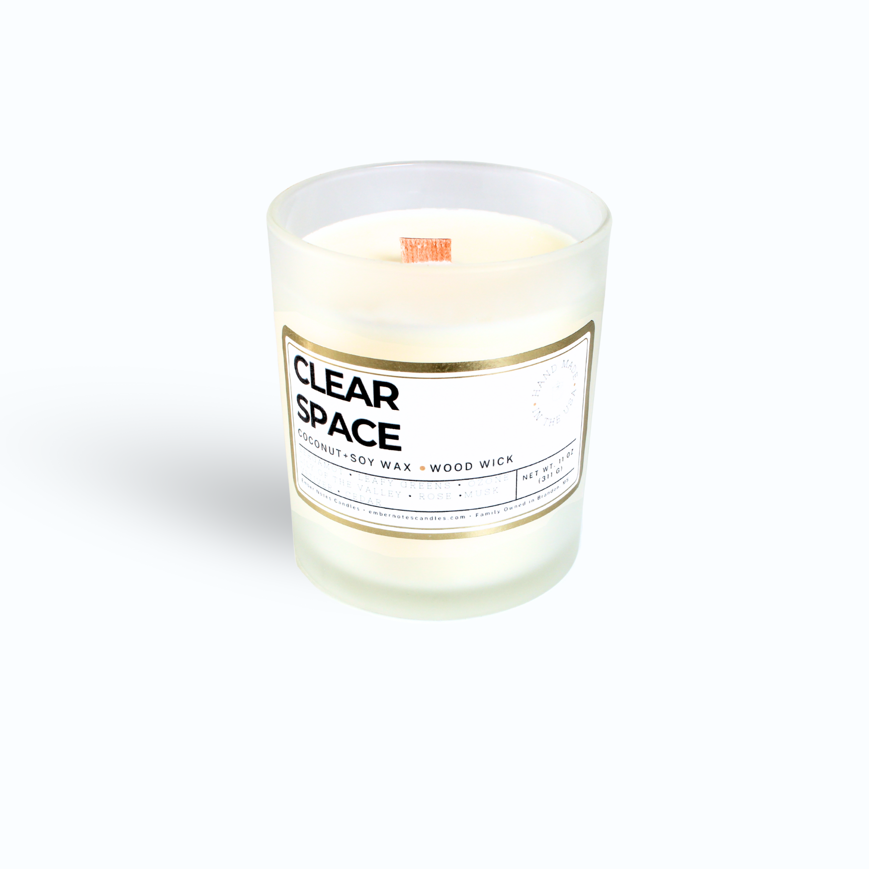 Candle with clear space label on the front in front of a white background 