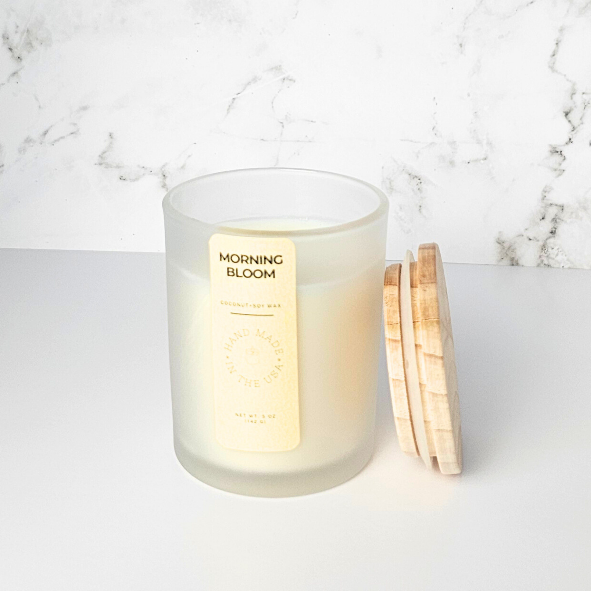 Wickless Candle labeled 'Morning Bloom' on a marble surface