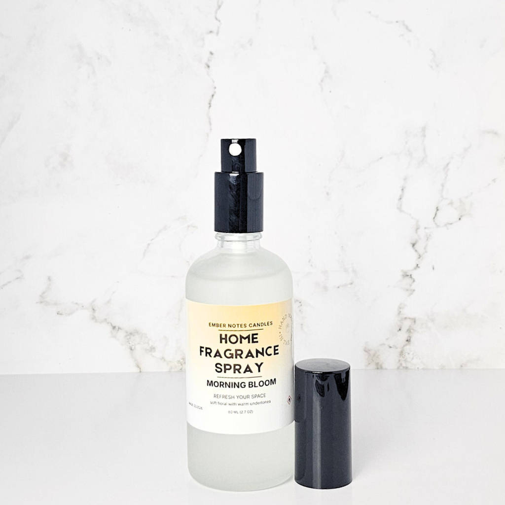 Home fragrance spray bottle labeled 'Morning Bloom' on a marble background