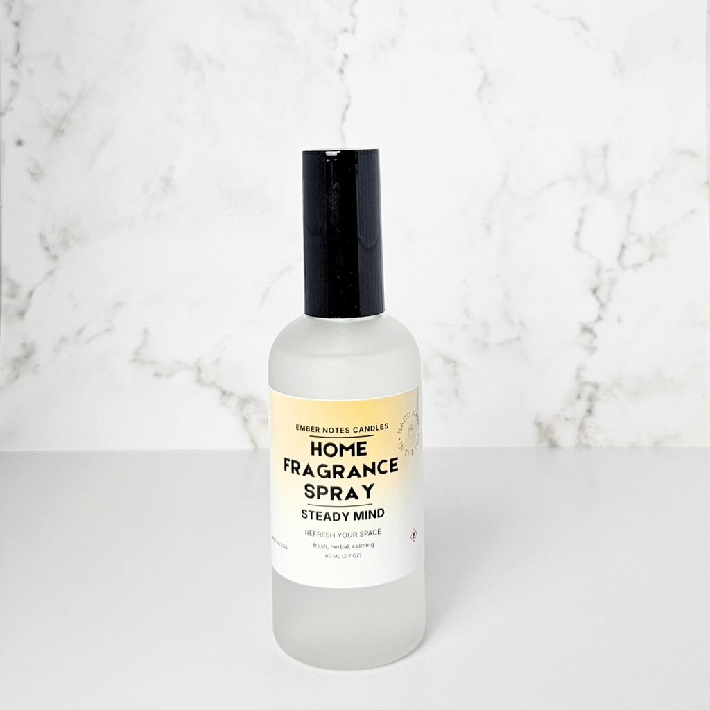 Home fragrance spray bottle on a marble background