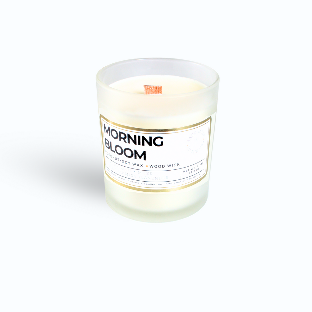 A candle with a label that says Morning Bloom