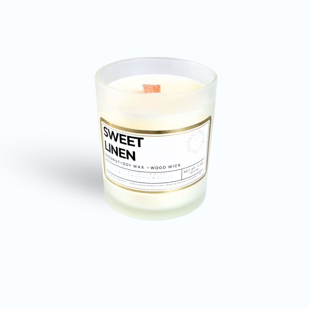 Candle on a white background with sweet Linen on the label