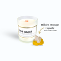 A candle with a label that says True Grace