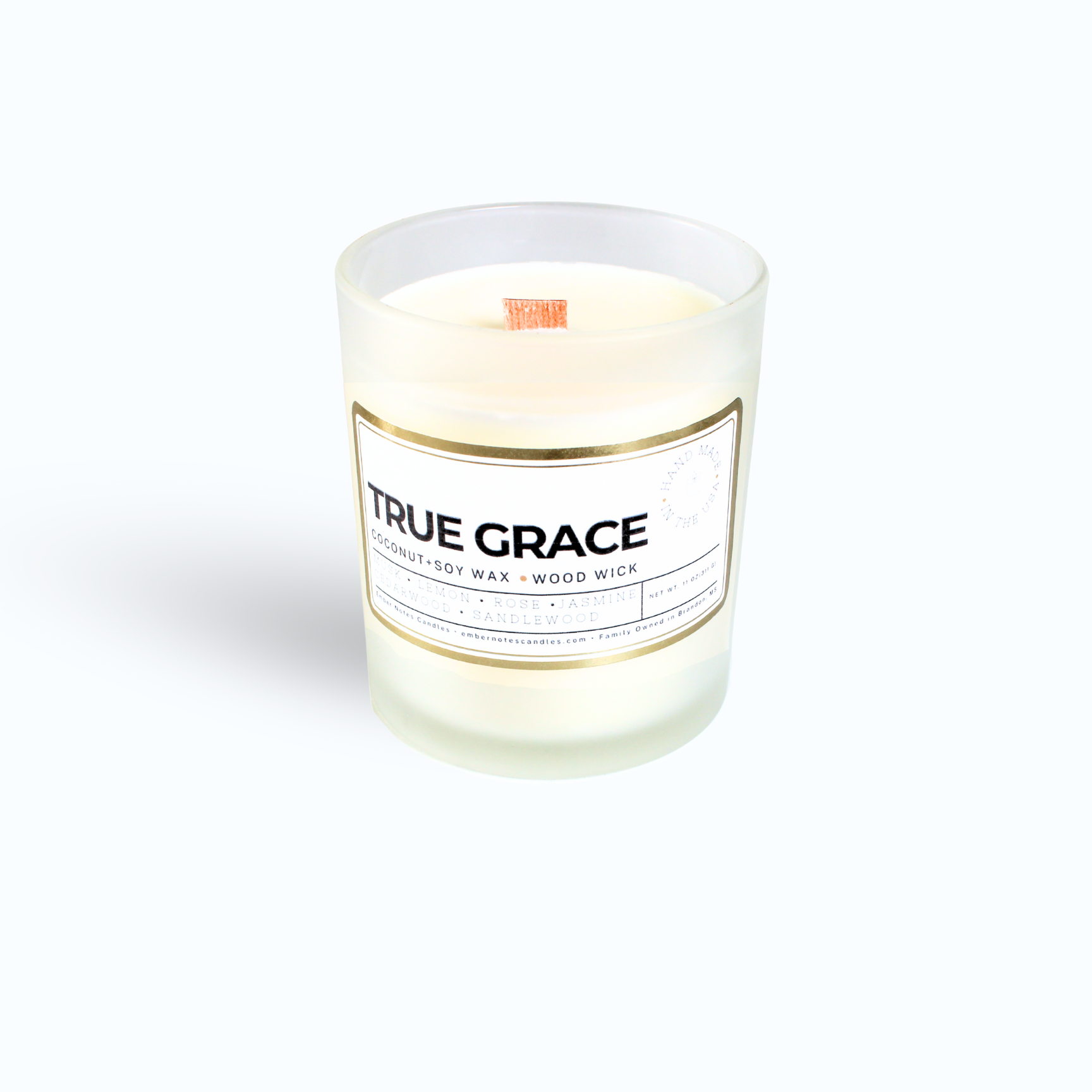 A candle with a label that says True Grace